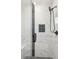 Luxurious bathroom shower with mosaic floor and black hardware at 2317 S Galapago St, Denver, CO 80223