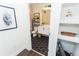 Modern bathroom with hexagon tile flooring, white vanity, and stylish decor at 2876 W 53Rd Ave # 106, Denver, CO 80221