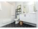 Modern bathroom featuring hexagon tile floor, shower with white subway tiles, and floating vanity with framed mirror at 2876 W 53Rd Ave # 106, Denver, CO 80221