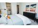 Comfortable bedroom showcasing a bed with closet space, and stylish decor at 2876 W 53Rd Ave # 106, Denver, CO 80221