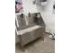 Dedicated dog washing station with stainless steel basin, making pet care convenient and accessible for residents at 2876 W 53Rd Ave # 106, Denver, CO 80221