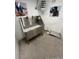 Dog washing station with ramp, stainless steel basin, and grooming supplies, for convenient on-site pet care at 2876 W 53Rd Ave # 106, Denver, CO 80221