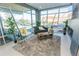 A bright living room with large windows and modern furnishings at 2876 W 53Rd Ave # 106, Denver, CO 80221