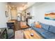Inviting living area with dining space featuring hardwood floors, natural light, and contemporary furnishings at 2876 W 53Rd Ave # 106, Denver, CO 80221