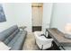 Functional office with comfortable sofa, desk, and modern decor, creating a productive and stylish space at 2876 W 53Rd Ave # 106, Denver, CO 80221