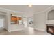 Open concept living room, dining area and kitchen with light wood floors and ample natural light at 1801 S Dunkirk St # 108, Aurora, CO 80017