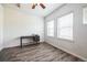 Comfortable bedroom with plenty of natural light and wood-look floors at 18726 E Yale Cir # D, Aurora, CO 80013