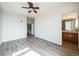 Spacious bedroom with wood floors and a convenient en-suite bathroom at 18726 E Yale Cir # D, Aurora, CO 80013