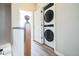 Conveniently located laundry area with stacked washer and dryer units on the upper level at 18726 E Yale Cir # D, Aurora, CO 80013