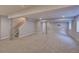 Finished basement with neutral carpet and columns at 8545 Braun Loop, Arvada, CO 80005
