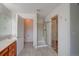 Bright bathroom featuring tiled floors, a shower with glass doors, and a separate toilet room at 8545 Braun Loop, Arvada, CO 80005