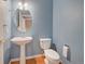 Charming powder bathroom with pedestal sink and modern fixtures at 8545 Braun Loop, Arvada, CO 80005