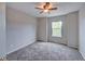 Inviting bedroom with carpet floors and a view of the yard through the window at 8545 Braun Loop, Arvada, CO 80005
