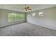 Large bedroom featuring plush carpet, neutral walls and plenty of natural light at 8545 Braun Loop, Arvada, CO 80005