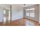 Hardwood floored dining area featuring an archway into another room and modern lighting at 8545 Braun Loop, Arvada, CO 80005