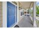 Close up front door and the inviting entryway of this home with views from the porch at 8545 Braun Loop, Arvada, CO 80005
