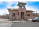 Depot exterior with brick facade, tower clock, and vintage lampposts on a tree-lined street at 8545 Braun Loop, Arvada, CO 80005