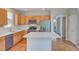 Well-equipped kitchen featuring stainless steel appliances, wooden cabinets, and a center island at 8545 Braun Loop, Arvada, CO 80005