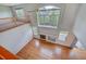Bright living room featuring a soaring ceiling, fireplace, and hardwood floors at 8545 Braun Loop, Arvada, CO 80005
