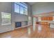 Spacious living room with fireplace, hardwood floors and plenty of natural light at 8545 Braun Loop, Arvada, CO 80005
