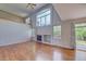 Vaulted living room featuring a fireplace and hardwood floors at 8545 Braun Loop, Arvada, CO 80005