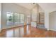 Bright and airy living room featuring hardwood floors and large windows at 8545 Braun Loop, Arvada, CO 80005