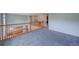 Open loft area featuring a wooden railing overlooking the lower level at 8545 Braun Loop, Arvada, CO 80005