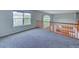 Cozy loft space with plush carpeting, large windows, and natural light at 8545 Braun Loop, Arvada, CO 80005