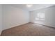 Neutral bedroom with carpet and a window allowing natural light at 16251 E 17Th Pl # C, Aurora, CO 80011