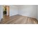 An open-concept living room featuring modern flooring and bright, neutral walls at 16251 E 17Th Pl # C, Aurora, CO 80011
