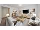 Comfortable living room with white sofas, modern decor, and a workspace with desk at 16251 E 17Th Pl # C, Aurora, CO 80011