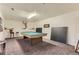 Spacious basement area with a pool table and a ping pong table for entertaining guests at 740 N Pearl St # 503, Denver, CO 80203