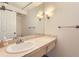 Bright bathroom features a large mirror, modern vanity, and ample lighting, creating a clean and inviting space at 740 N Pearl St # 503, Denver, CO 80203