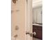 Bathroom features tiled shower walls, and bronze fixtures with a partial view of the vanity with a granite countertop at 740 N Pearl St # 503, Denver, CO 80203
