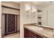 Bathroom features a single sink, granite countertop and a closet for storage, offering functionality and style at 740 N Pearl St # 503, Denver, CO 80203