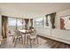 Well-lit dining room featuring a modern chandelier and stunning city views at 740 N Pearl St # 503, Denver, CO 80203
