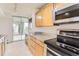 Bright kitchen with modern appliances, ample counter space, and access to the sunroom at 740 N Pearl St # 503, Denver, CO 80203