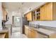Beautiful open concept kitchen boasts stainless appliances, granite counters, glass-front cabinets and a seamless flow into the living area at 740 N Pearl St # 503, Denver, CO 80203