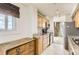 This warm kitchen features modern appliances, tile floor, plenty of cabinet space, and a large window with a view at 740 N Pearl St # 503, Denver, CO 80203