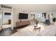 Bright living room with modern furnishings and an open floor plan to the dining area at 740 N Pearl St # 503, Denver, CO 80203