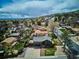 Stunning aerial view of home nestled in a picturesque neighborhood with lush greenery and scenic mountain backdrop at 13588 W Exposition Dr, Lakewood, CO 80228