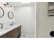 Bright bathroom features a tiled stand-up shower and a dual sink vanity at 13588 W Exposition Dr, Lakewood, CO 80228