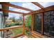 Inviting backyard deck with a pergola, stylish screen, and views of the lush backyard at 13588 W Exposition Dr, Lakewood, CO 80228