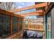 Deck with wood pergola featuring a geometric screen and grill, providing a relaxing outdoor space at 13588 W Exposition Dr, Lakewood, CO 80228