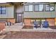 Inviting front porch area with chairs, planters, and a stylish entrance, enhancing curb appeal at 13588 W Exposition Dr, Lakewood, CO 80228