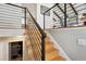 Modern staircase with black railing leads to the upper level, near the laundry room at 13588 W Exposition Dr, Lakewood, CO 80228