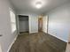 Empty bedroom with neutral paint, carpeted floor and closet at 1273 S Jackson St, Denver, CO 80210