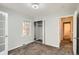 Bright bedroom featuring neutral walls, carpet, closet, and natural light from the window at 1273 S Jackson St, Denver, CO 80210