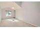 Bright, airy bedroom with neutral walls, carpet, a pendant lamp and vaulted ceilings at 1273 S Jackson St, Denver, CO 80210