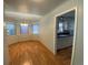 Bright dining room with bay window, hardwood floors, and open access to a kitchen area at 1273 S Jackson St, Denver, CO 80210
